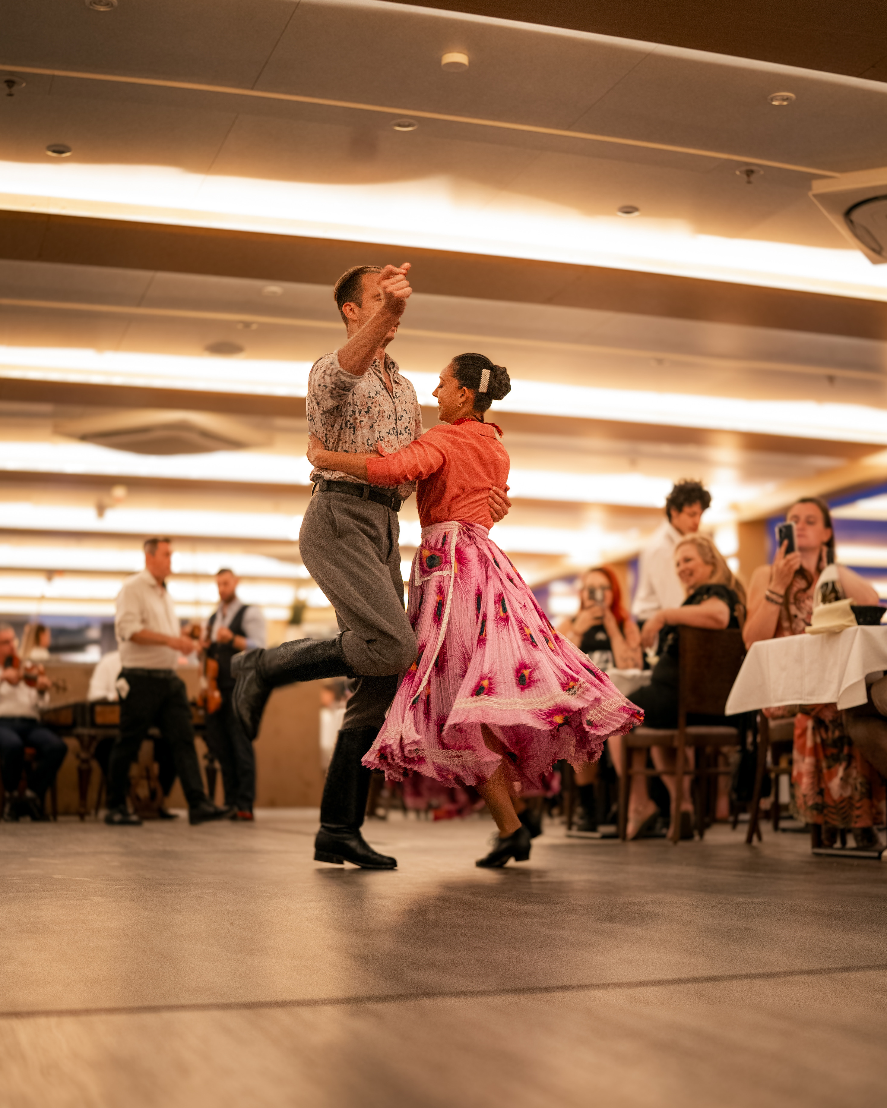 Couple dancing on a river cruise
