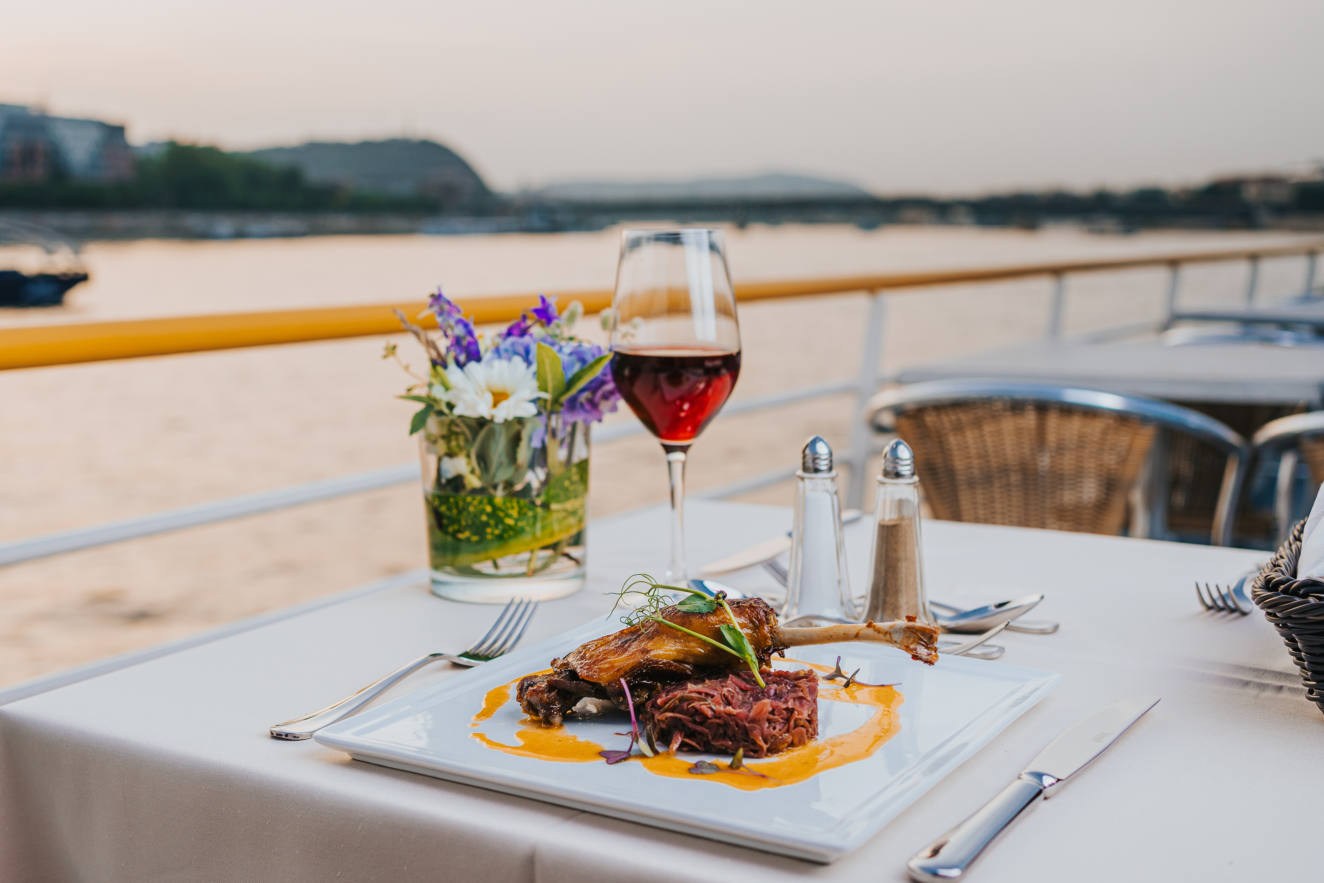Dinner with wine on a river cruise deck